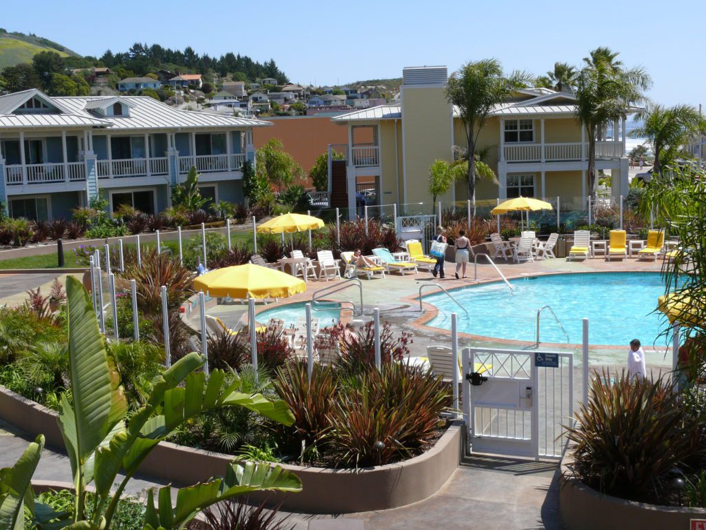 Avila Lighthouse Suites - Overview of roof deck patio, landscaping and pool deck.